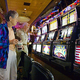 Various bus passengers survey the slots at the Oasis.
